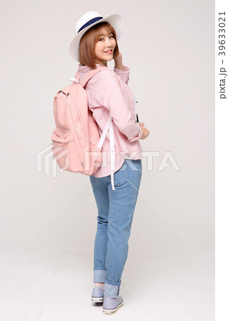 Young traveler woman with a backpack concept isolated on White photo. 007 39633021