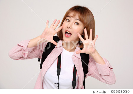 Young traveler woman with a backpack concept isolated on White photo. 026 39633050
