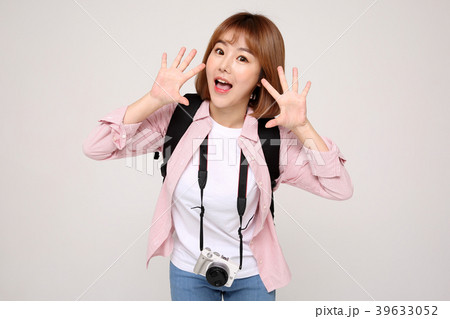 Young traveler woman with a backpack concept isolated on White photo. 025 Young traveler woman with a backpack concept isolated on White photo. 025 39633052