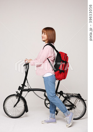 Young traveler woman with a backpack concept isolated on White photo. 135 Young traveler woman with a backpack concept isolated on White photo. 135 39633056