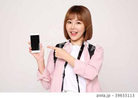 Young traveler woman with a backpack concept isolated on White photo. 062 39633113