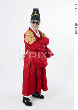 A middle-aged man who dressed a king's clothes making funny expression photo. 378 39633151