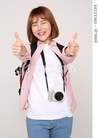 Young traveler woman with a backpack concept isolated on White photo. 034 Young traveler woman with a backpack concept isolated on White photo. 034 39633299