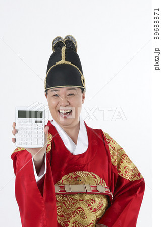 A middle-aged man who dressed a king's clothes making funny expression photo. 365 39633371