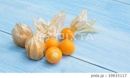 Cape gooseberry on a blue wooden table. Cape gooseberry on a blue wooden table. 39635117