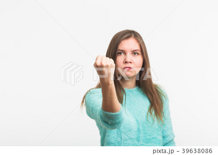 Angry aggressive woman with ferocious expression Angry aggressive woman with ferocious expression 39638086