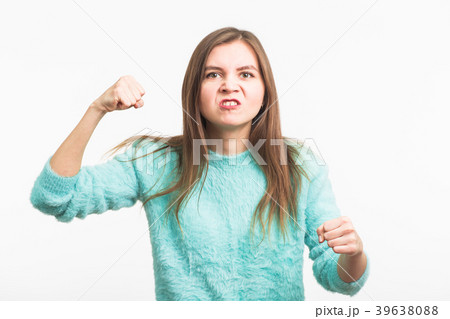 Angry aggressive woman with ferocious expression Angry aggressive woman with ferocious expression 39638088