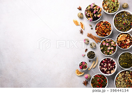 Assortment of dry tea in white bowls. Tea types Assortment of dry tea in white bowls. Tea types 39644134