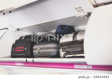 Hand-luggage compartment with suitcases in 39644884