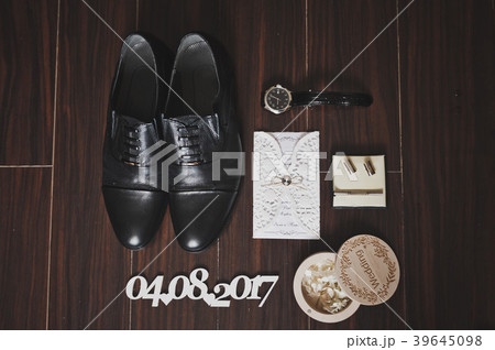 Shoes, watch and ring on the floor 534. 39645098