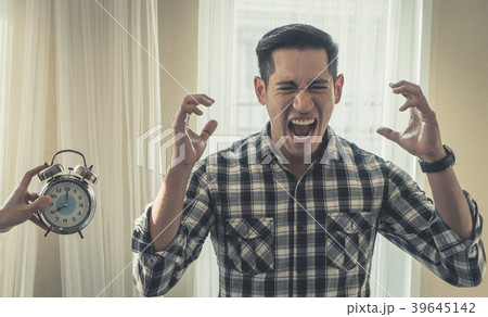 Casual male screaming stressed out alarm clock 39645142