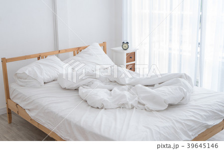 White messy bed in morning without people White messy bed in morning without people 39645146