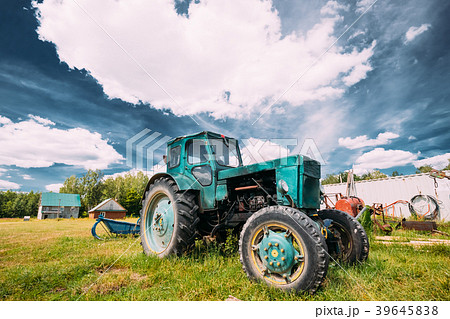 Old Tractor Parking In Backyard In Summer Sunny Old Tractor Parking In Backyard In Summer Sunny 39645838