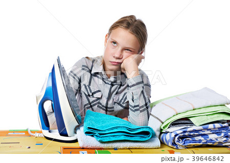 Tired girl with washed linen and iron isolated Tired girl with washed linen and iron isolated 39646842