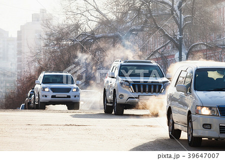 Cars on a crossroad in winter city Cars on a crossroad in winter city 39647007