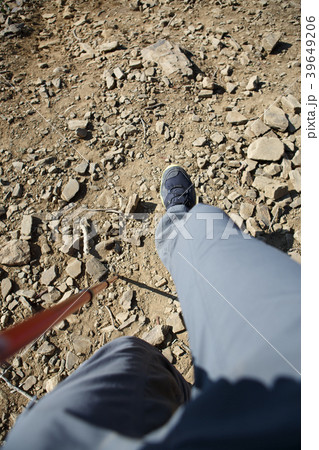 Photo of man in sneakers with walking stick 39649206