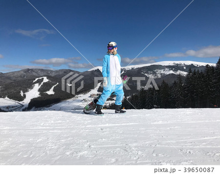 Girl in blue, pink unicorn pijama kigurumi outdoor 39650087
