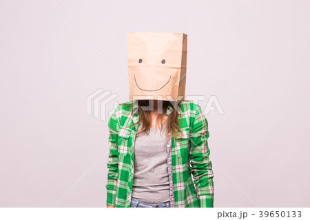 Happy unknown woman with a paper bag on her head 39650133