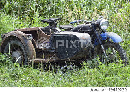 Old Soviet motorcycle with a cradle. An old Old Soviet motorcycle with a cradle. An old 39650279