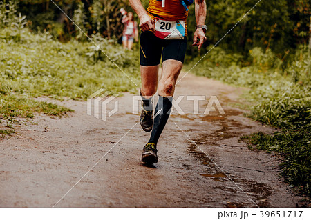 athlete runner with a number on a t-shirt athlete runner with a number on a t-shirt 39651717