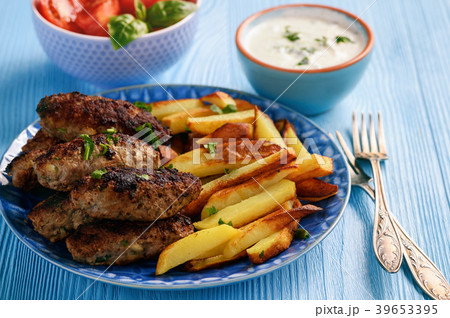 Cevapcici, balkanian grilled meat sausages. 39653395