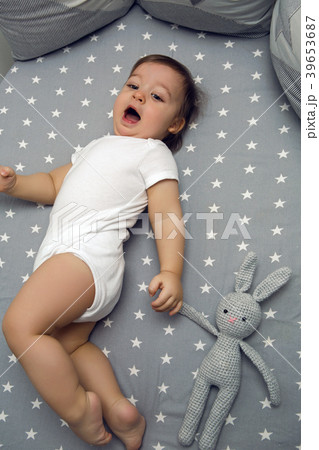 one year old baby boy lying in a round bed one year old baby boy lying in a round bed 39653687