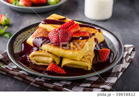 Filled pancakes with strawberries 39658812