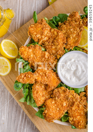 Chicken strips with delish garlic dip Chicken strips with delish garlic dip 39659245