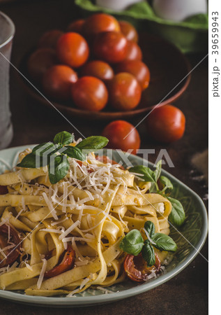Pasta semolina with tomatoes and parmesan cheese Pasta semolina with tomatoes and parmesan cheese 39659943