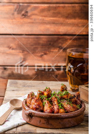 Grilled chicken wings with beer 39660694