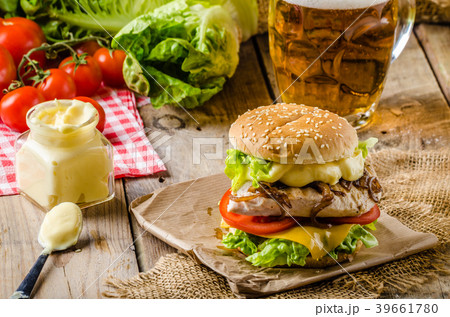 Chicken burger, cold beer Chicken burger, cold beer 39661780
