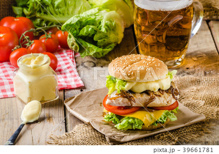 Chicken burger, cold beer Chicken burger, cold beer 39661781