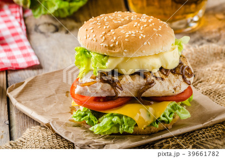 Chicken burger, cold beer Chicken burger, cold beer 39661782