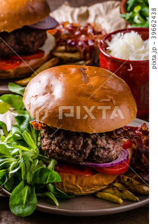 Beef burger with bacon and french fries 39662438