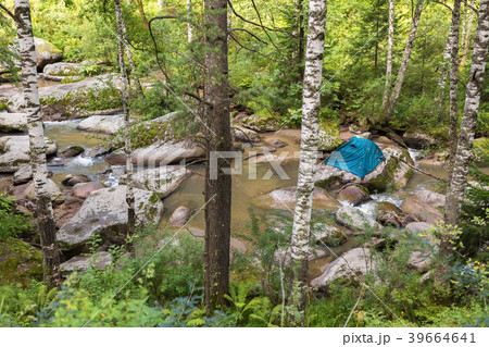 Tourist tent on a boulder in the middle of Tourist tent on a boulder in the middle of 39664641