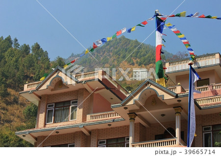 Prayer flags on top of a roof in Syabru Besi. Prayer flags on top of a roof in Syabru Besi. 39665714