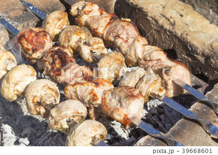 Meat dish on an open fire 39668601