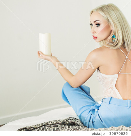 Beautiful woman with candle at home Beautiful woman with candle at home 39670626