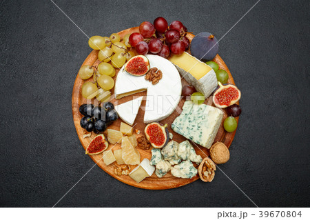 Brie cheese on a wooden Board with fresh figs and 39670804