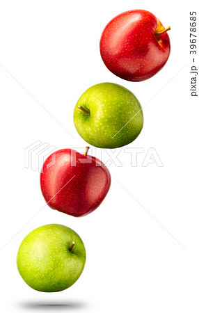 Falling red and green apples on white background Falling red and green apples on white background 39678685