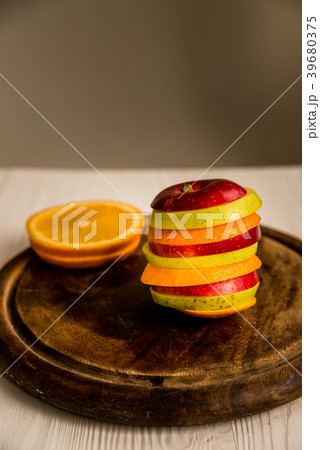 Mixed slices of orange, red and green apple Mixed slices of orange, red and green apple 39680375