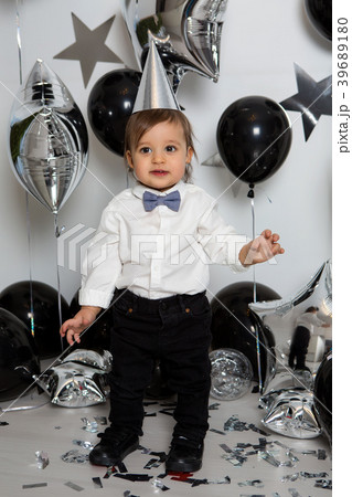 boy in black clothes on his birthday party with boy in black clothes on his birthday party with 39689180