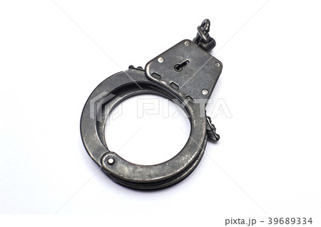 Old handcuffs on white background Old handcuffs on white background 39689334
