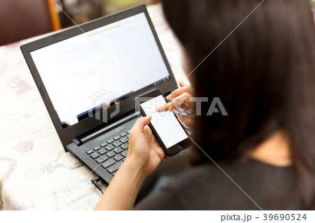 Business woman working with smart phone and laptop 39690524