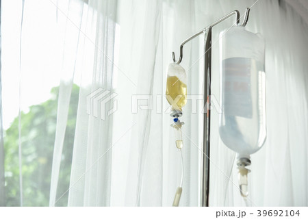 Close up saline IV drip. 39692104