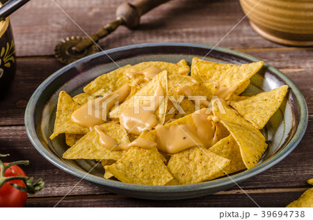 Nachos with homemade cheese dip 39694738