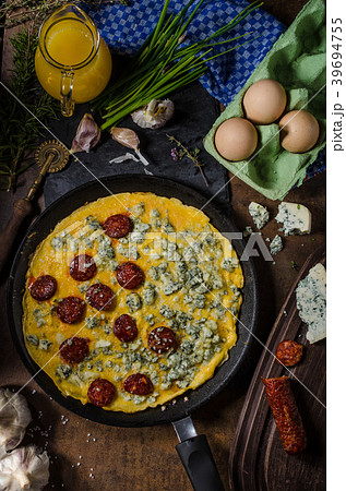 Omelet with blue cheese and sausage Omelet with blue cheese and sausage 39694755