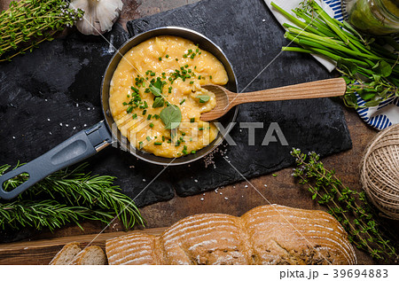 Scrambled eggs in a frying pan 39694883