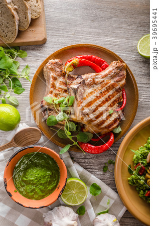 Grilled Pork Chops, risotto with portobello Grilled Pork Chops, risotto with portobello 39695441