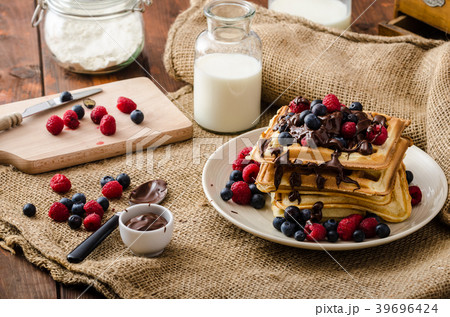 Waffles with fruits and chocolate 39696424
